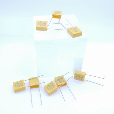 Kapasitor Pelepas Tekanan Resistif Dan Kapasitif 0.1UF 310V P7.5MM Warna Kuning